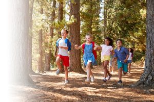 kids running in the forest